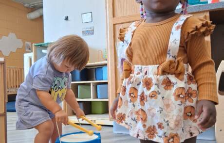 Toddlers exploring rhythm and drumming in our Milwaukee early childhood classroom Toddlers exploring rhythm and drumming in our Milwaukee early childhood classroom